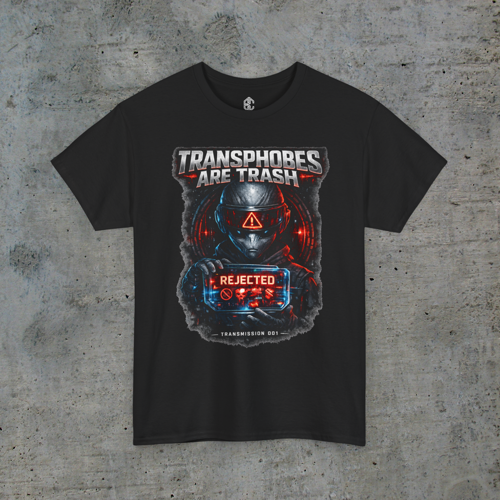 Front view of black Transphobes Are Trash trans rights graphic tee on a light-gray concrete background